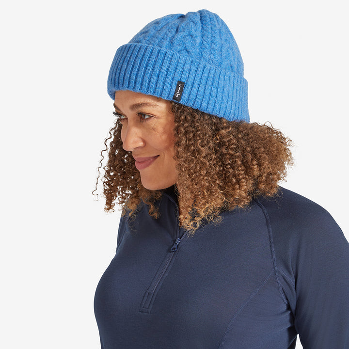 Woman wearing a Pacific Blue Genus Cable Knit Merino Wool Hat 