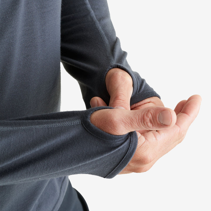 Thumb holes on the Genus Men's Charcoal Eden Zip-Neck Top