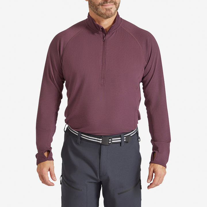 Man wearing a Genus Men's Prune Damson Eden Zip neck Top tucked in