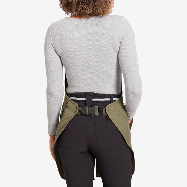Back view of a Genus gardening apron on a woman