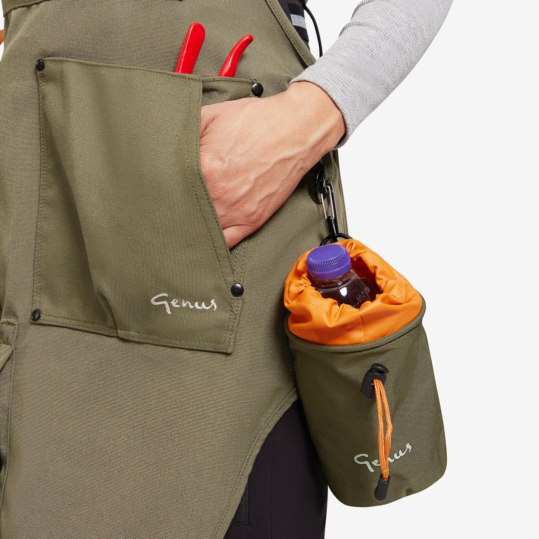 Close up of a Genus gardening apron with a bottle holder