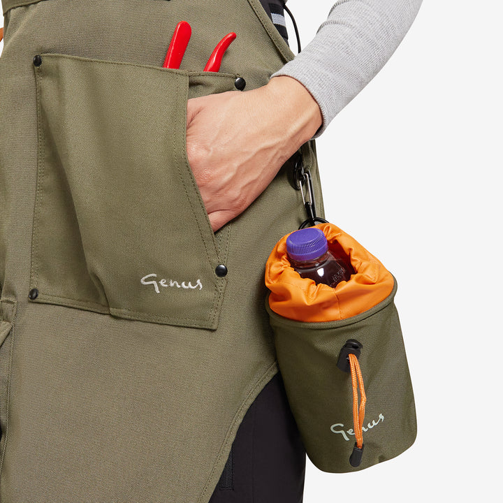 Close up of a Genus gardening apron with a bottle holder