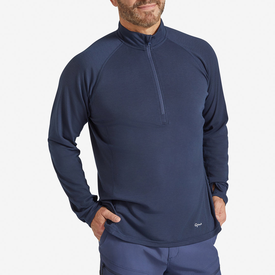 Man wearing a Genus Men's Marine Blue Eden Zip Neck Top 