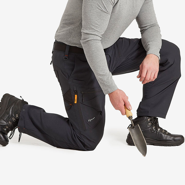 Man kneeling down wearing the Genus Men's Gardening Propants