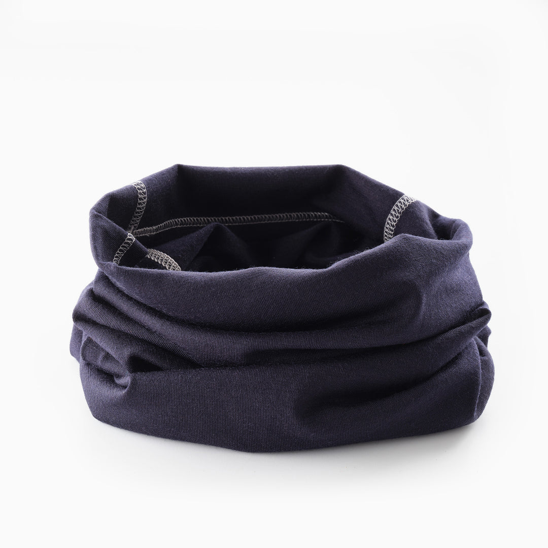 Genus merino winter neckwarmer on a white surface