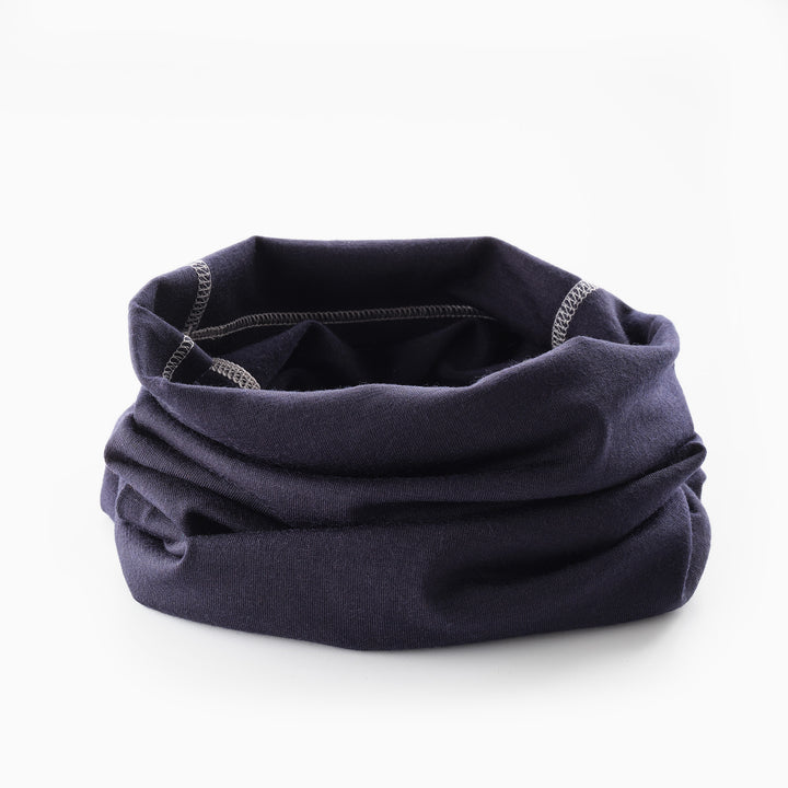 Genus merino winter neckwarmer on a white surface