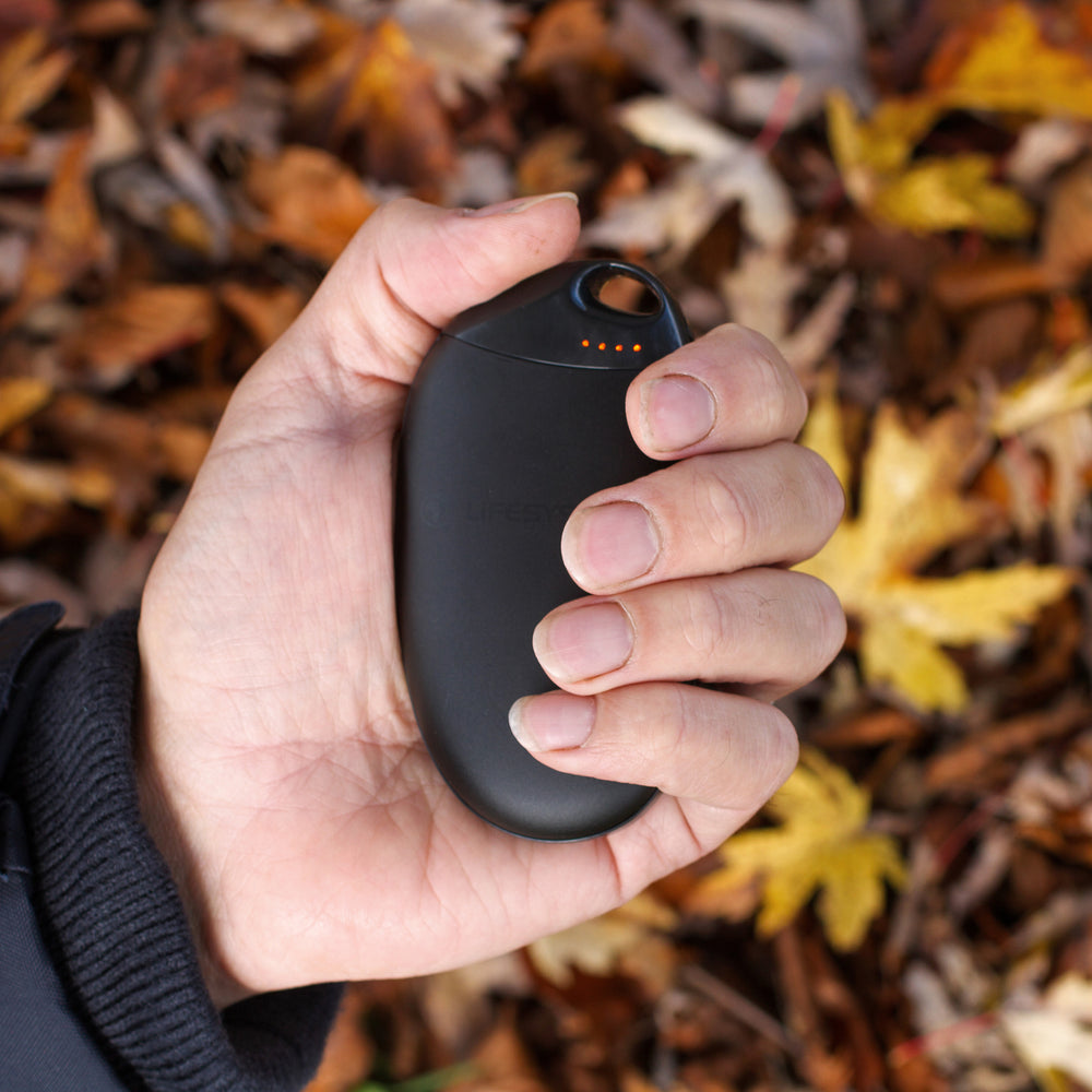 Genus Rechargeable Hand Warmer in a person's hand