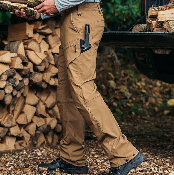 Man wearing a pair of Genus Men's 3 Season Gardening Trousers Tan in his garden